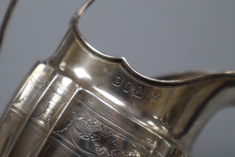 A George III Irish silver helmet shaped cream jug by Gustavus Byrne, Dublin, 1801, 13.3cm, 4.5 oz.